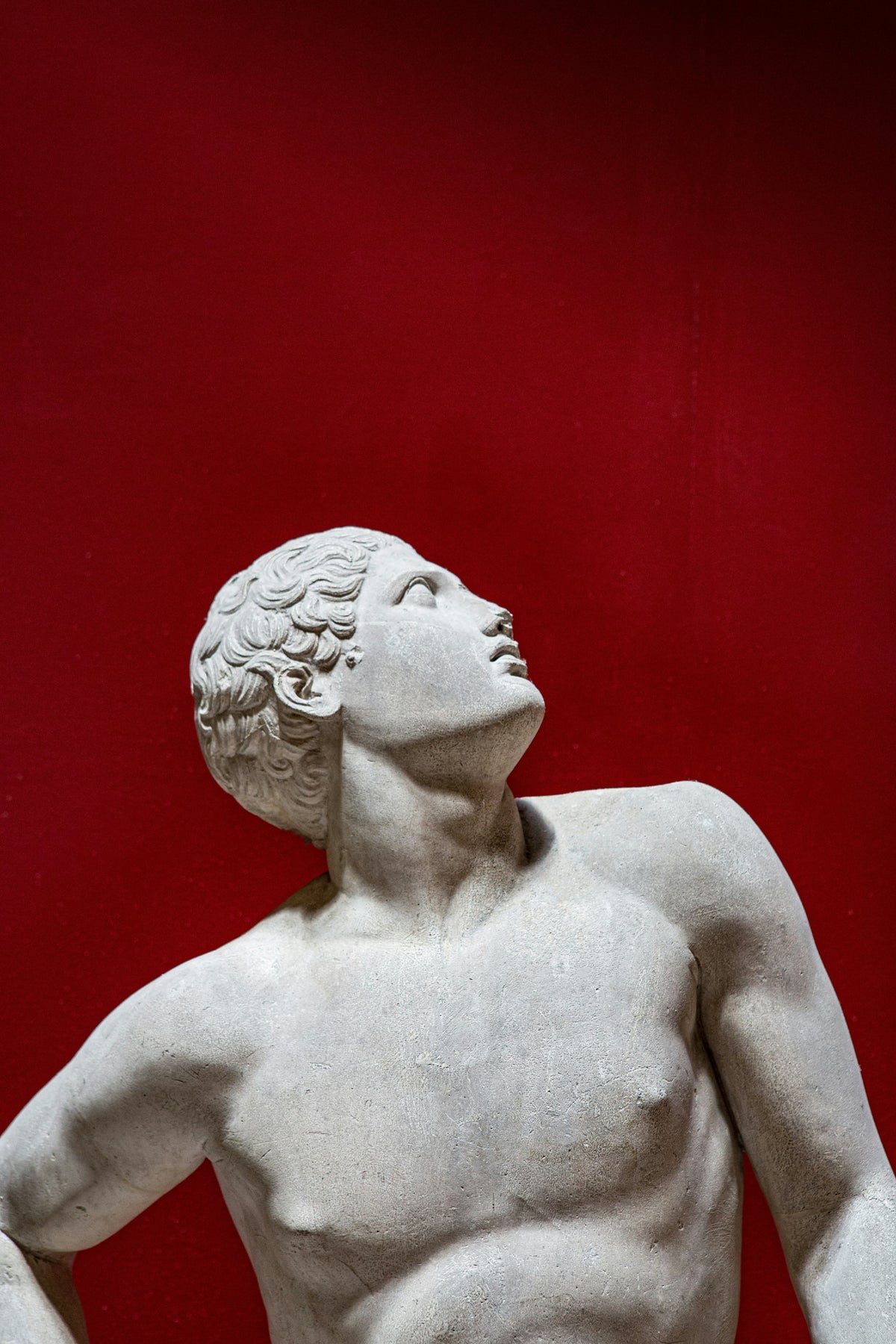 Torso of marble Greek sculpture of male hero.