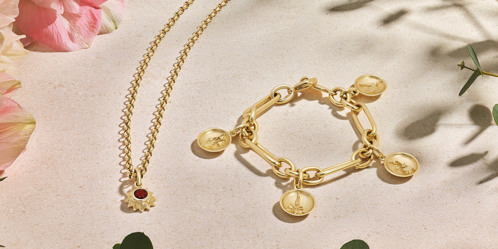Cassandra Goad yellow gold bracelet charms and necklace pendant